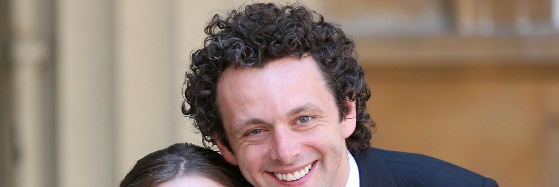 Michael Sheen and his daughter Lily with the Order of the British Empire he received from Queen Elizabeth II during investitures at Buckingham Palace on June 2, 2009.